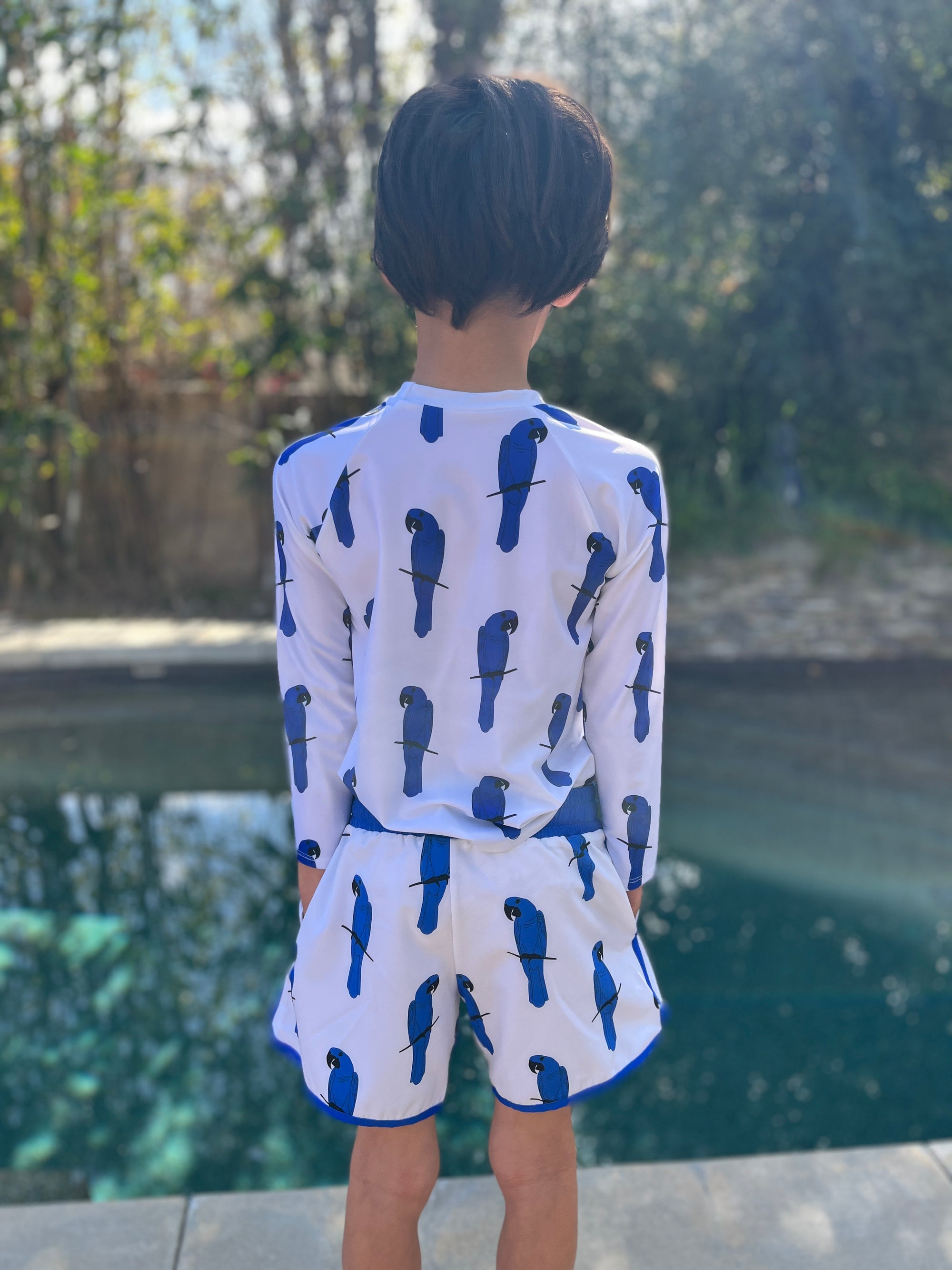 Kid's Sustainable Swim Board Shorts  Blue Macaw | Jollin